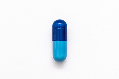 Photo of a dark and light blue capsule